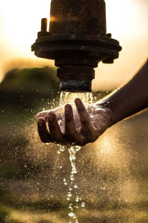 water pouring on pipe